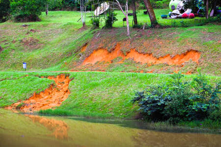 Soil erosion or landslide on the lake in the rainy season at Muadzam Shah, Malaysia.の写真素材