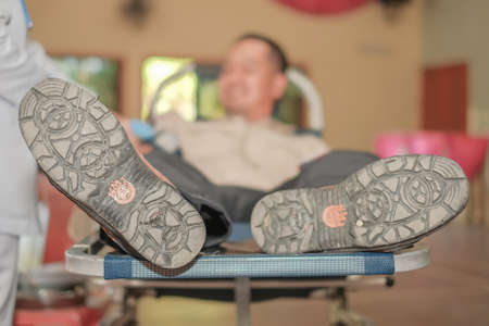 Muadzam Shah,  Malaysia - February 21st, 2018 : Unidentified man in blood donation chair during blood donation campaignのeditorial素材