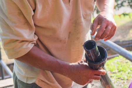 Muadzam Shah, Malaysia  February 8th, 2018  : Pipe contractor install new HDPE pipes under the interlocking bricks walkway.のeditorial素材