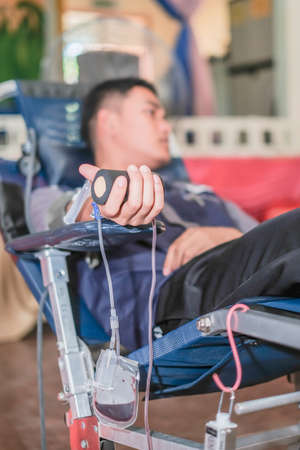 Muadzam Shah,  Malaysia - February 21st, 2018 : Blood donor at donation with a bouncy ball holding in hand.のeditorial素材