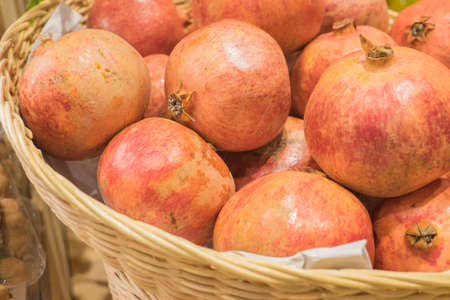 Pomegranate fruit  in the basket . Healthy eating concept.の写真素材