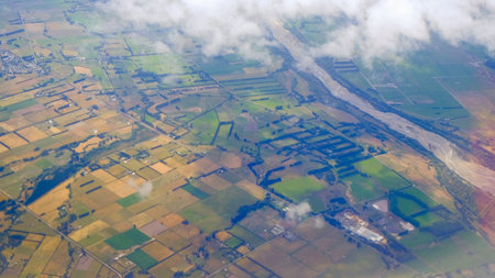 Beautiful landscape green field views from an airplane window during depart at Christchurch...