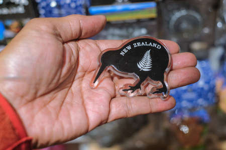 CHRISTCHURCH , NEW ZEALAND - DECEMBER 19th ,2017 : Man holding kiwi souvenir for sale in DF Souvenir.のeditorial素材