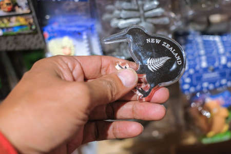 CHRISTCHURCH , NEW ZEALAND - DECEMBER 19th ,2017 : Man holding kiwi souvenir for sale in DF Souvenir.のeditorial素材