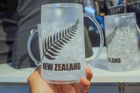 Christchurch, New Zealand  December 19th, 2017 : Man holding New Zealand souvenir mug in souvenir shop.のeditorial素材