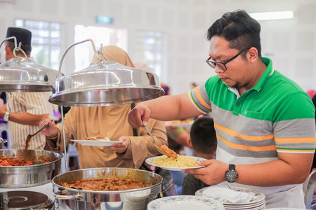 Pekan, Malaysia - March 24th, 2018 : View of buffet line at wedding ceremony in Malaysia. Selective...