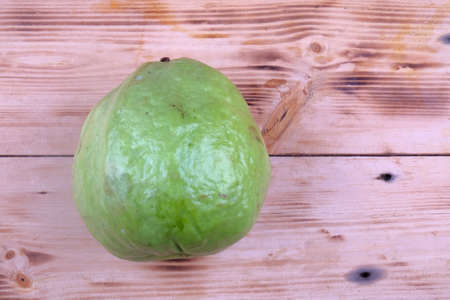 Close up view of guava on wooden tableの写真素材