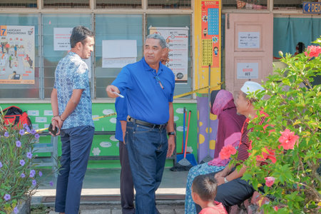 Muadzam Shah, Malaysia - May 9th, 2018: Malaysian voters line up to vote at the election center...