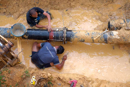 Nuadzam Shah, Malaysia - November 1st, 2018 : Construction site water supply project at working for welding the connecting of HDPE pipeのeditorial素材