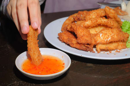 Deep fried squids with sauceの写真素材