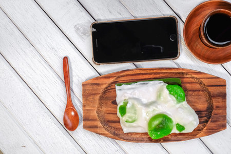 Badak berendam a local Malaysian dessert and cuf of coffee  on wooden background
