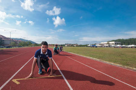 Muadzam Shah, Malaysia - November 22nd, 2018. Muadzam Shah's Vocational College annual sports game.  Athletes men and women  ran 100, 200, 400, 800 meters, relays 4 * 100 and 4 * 400のeditorial素材