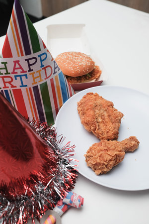 Man holding fried chicken on white background