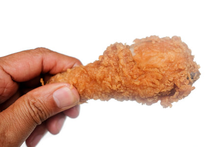 Man holding fried chicken on white backgroundの写真素材