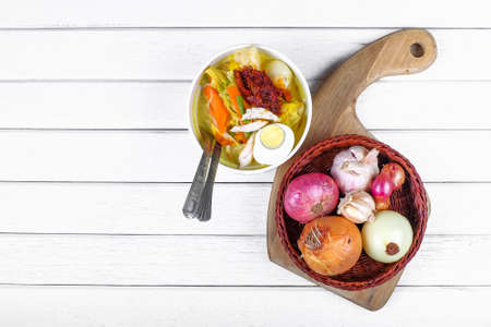 Lontong-Traditional Malaysian and   Indonesian food on wooden table with spoon.の写真素材