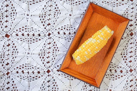 The steamed corn of the pearl corn is distinguished by the yellow and white kernels.の写真素材