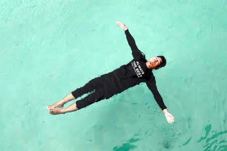 Perhentian  Island , Malaysia - August 15th, 2018 :Top view of sea diver  in a water suit is...