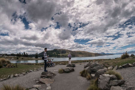 Lake Tekapo, New Zealand â December 16th, 2017 :  Visitors from around the world were enjoying view of lake and church at lake Tekapo in the afternoon.のeditorial素材
