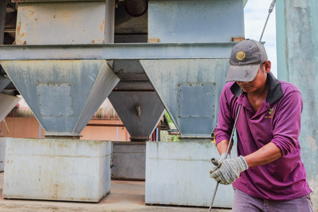 Muadzam Shah, Malaysia - January 3rd, 2019 : The worker clears the clogged sewer drain using a...