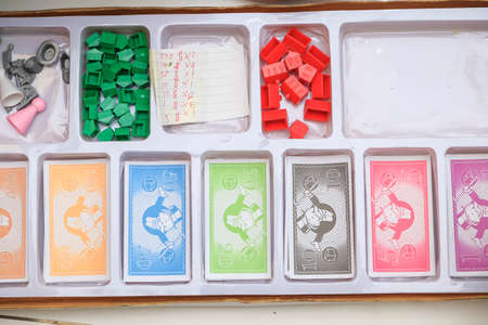 Muadzam Shah, Malaysia â December 3rd, 2017  : Pile of monopoly money on the box . The classic trading game from Parker Brothers was first introduced to America in 1935.のeditorial素材