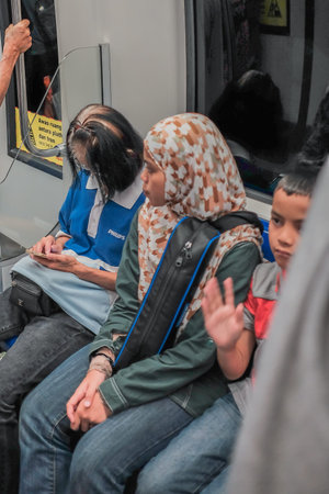 KUALA LUMPUR, MALAYSIA - December 31th,  2017: Passengers inside Mass Rapid Transit MRT train . MRT...