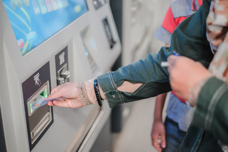 KUALA LUMPUR, MALAYSIA - December 31st ,  2017:  Passenger buying ticket from vending machines...