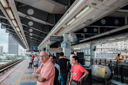KUALA LUMPUR, MALAYSIA - December 31st ,  2017: Passengers are waiting for MRT Mass Rapid Transit arrival. MRT is Mass Rapid Transit Corporation Sdn Bhd, in Kuala Lumpur, Malaysia.のeditorial素材