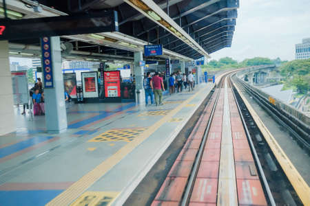 KUALA LUMPUR, MALAYSIA - December 31st ,  2017: Passengers are waiting for MRT Mass Rapid Transit arrival. MRT is Mass Rapid Transit Corporation Sdn Bhd, in Kuala Lumpur, Malaysia.のeditorial素材