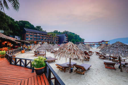 Perhentian Island , Malaysia- August 15th, 2018 :Attap dwelling umbrella and sun beds on sand beach  at Perhentian Island, Malaysia.Vacation Concept.のeditorial素材