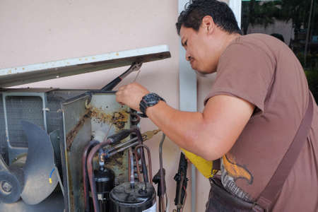 Muadzam Shah, Malaysia - May 15th, 2019 : Air conditioning technician checking,repairing and maintenance at Kolej Vokasional Muadzam Shah, Malaysia.のeditorial素材
