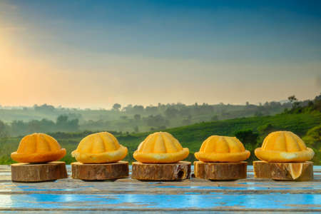 Malaysia traditional sweet as known as Baulu or Bahulu, make from eggs, sugar and fluor  during beautiful sunrise.の写真素材