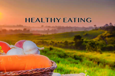 Group of vegetables on cutting board  in beautiful sunriseの写真素材