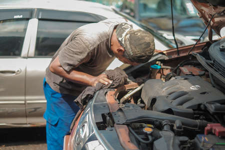 Muadzam Shah, Malaysia - June 1st,  2019:  Car mechanic working at automotive service center.のeditorial素材