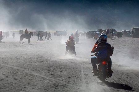 BROMO, INDONESIA -August 3rd, 2019 : Colourful tourist jeeps with horse at the parking areas near...