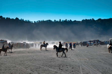 BROMO, INDONESIA -August 3rd, 2019 : Colourful tourist jeeps with horse at the parking areas near Hindu temple Pura Luhur Poten, Bromo crater in savanna of Tengger caldera at Mt. Bromo, East Java.のeditorial素材