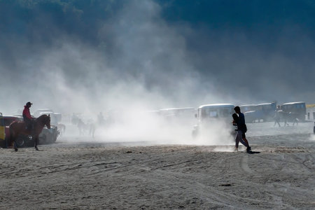 BROMO, INDONESIA -August 3rd, 2019 : Colourful tourist jeeps with horse at the parking areas near...