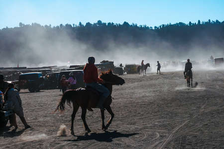 BROMO, INDONESIA -August 3rd, 2019 : Colourful tourist jeeps with horse at the parking areas near Hindu temple Pura Luhur Poten, Bromo crater in savanna of Tengger caldera at Mt. Bromo, East Java.のeditorial素材