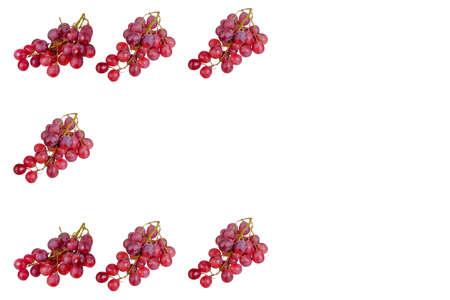 Fresh bunch of grapes on plate isolated on white backgroundの写真素材