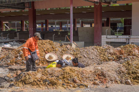 Muadzam Shah, Malaysia - August 19th, 2019 : Electrical engineer technician fixing high voltage underground cable wire installation.のeditorial素材