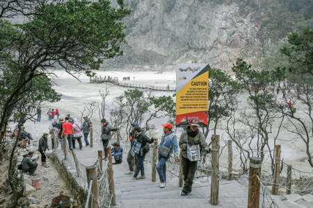 Bandung, Indonesia - November 29th, 2019 : Tourists take pictures in the White Crater ( Kawah Putih ) in Bandung, West Java, Indonesia.のeditorial素材