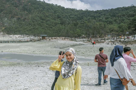 Bandung, Indonesia - November 29th, 2019 : Tourists take pictures in the White Crater ( Kawah Putih ) in Bandung, West Java, Indonesia.のeditorial素材