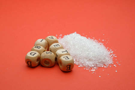 Health concept. Sugar with a DIABETES wording on red backgroundの写真素材