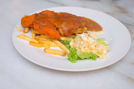Chicken chop with  french fried and vegetableの写真素材
