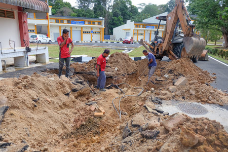 Muadzam Shah, Malaysia - January 31th,, 2020 : Electric cable repair, open trench with damaged cable...