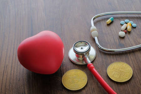 Medical background from pharmaceutical tablets and pills, stethoscope ,  red heart and coins .   Healthcare and medicine.の写真素材