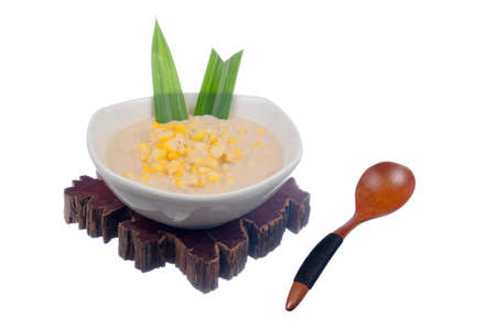 Corn porridge  in white bowl isolated on white backgroundの写真素材