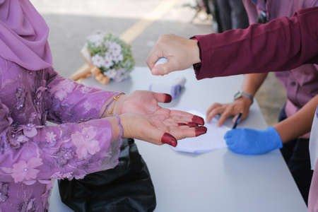 Muadzam Shah, Malaysia - May 9th,  2020 : A muslim couple getting solemnization  in medical face masks during coronavirus pandemic. COVID-19 weddings.のeditorial素材