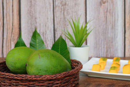 Sliced mango fruit on wooden background. Healthy Foodの写真素材