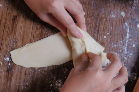 Woman making curry puff.