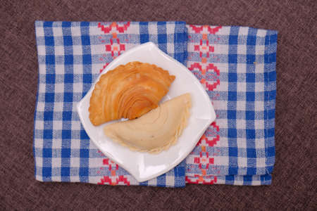 Malaysian favourite snack, curry puff on a white plateの写真素材